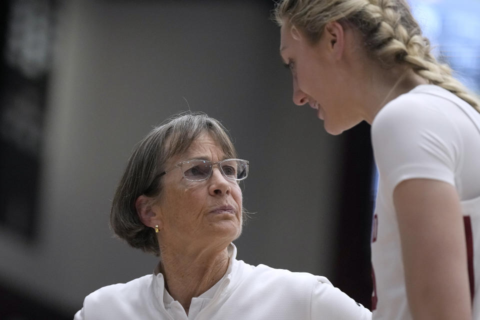 Stanford coach Tara VanDerveer talks with forward Cameron Brink during a timeout in the second half of the team's NCAA college basketball game against Oregon on Friday, Jan. 19, 2024, in Stanford, Calif. VanDerveer tied former Duke men's basketball coach Mike Krzyzewski for the most wins in college basketball history. (AP Photo/Tony Avelar)