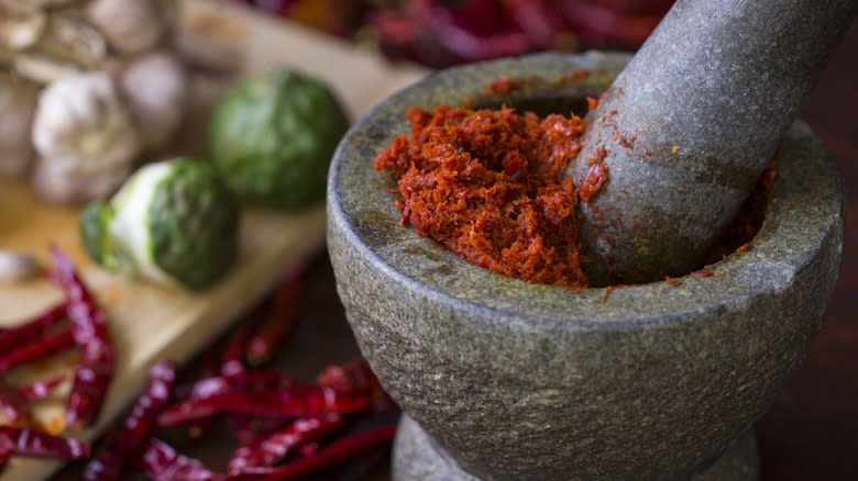 Curry paste inside mortar and pestle