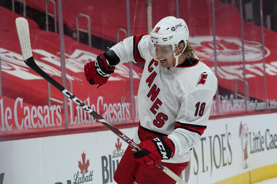 Carolina Hurricanes center Ryan Dzingel celebrates his goal against the Detroit Red Wings in the third period of an NHL hockey game Thursday, Jan. 14, 2021, in Detroit. Carolina won 3-0. (AP Photo/Paul Sancya)