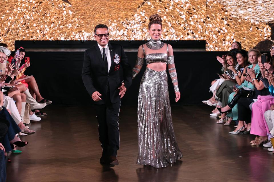 Designer Naeem Khan and Kate Beckinsale walk the runway at the Naeem Khan fashion show during September 2022 New York Fashion Week: The Shows at Sony Hall on September 09, 2022 in New York City.