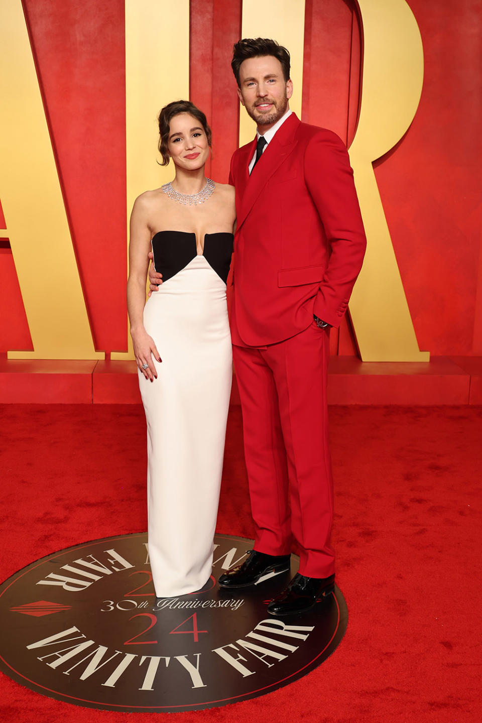 Alba Baptista and Chris Evans attend the 2024 Vanity Fair Oscar Party Hosted By Radhika Jones at Wallis Annenberg Center for the Performing Arts on March 10, 2024 in Beverly Hills, California.