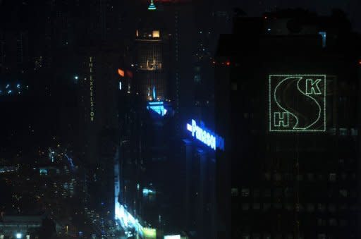 An illuminated logo of Sun Hung Kai Properties (R) adornes the company's headquarters in Hong Kong in March 2012. Sun Hung Kai is a blue-chip listed company and the city's biggest property developer by market capitalisation