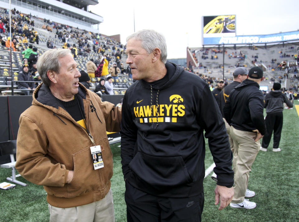 IOWA CITY, IOWA- OCTOBER 28:  Head coach Kirk Ferentz of the Iowa Hawkeyes visits with University President Bruce Harreld before the match-up against the Minnesota Golden Gophers on October 28, 2017 at Kinnick Stadium in Iowa City, Iowa.  (Photo by Matthew Holst/Getty Images)