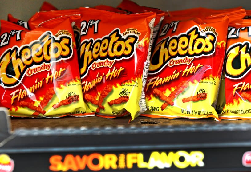 Bags of Cheetos Flamin' Hot Crunchy are displayed for sale at Touchdown Food Mart, September 27, 2012, in Chicago, Illinois. (John J. Kim/Chicago Tribune/Tribune News Service via Getty Images)