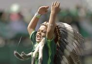 A boy dressed as the Chapecoense mascot cheers during a Sudamericana trophy award ceremony prior to a friendly match against Palmeiras, in Chapeco, Brazil, Saturday, Jan. 21, 2017. Almost two months after the air tragedy that killed 71 people, including 19 team players, Chapecoense plays at its Arena Conda stadium against the 2016 Brazilian champion Palmeiras. (AP Photo/Andre Penner)