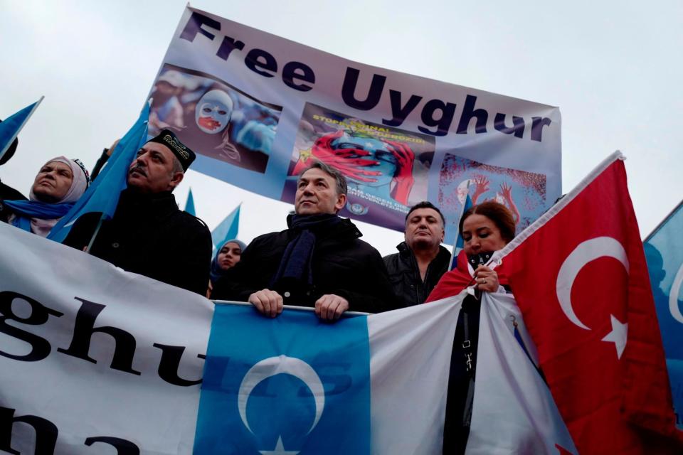 Demonstrators take part in a protest outside the Chinese embassy in Berlin to call attention to Chinas mistreatment of members of the Uyghur community in western China: Getty