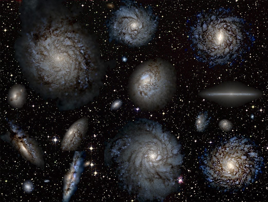 Several virtual galaxies against a starry background.