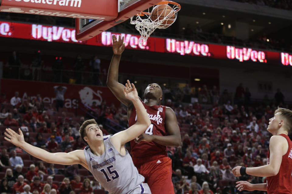 Northwestern's Ryan Young (15) watches his shot against Nebraska's Yvan Ouedraogo (24) during overtime in an NCAA college basketball game in Lincoln, Neb., Sunday, March 1, 2020. Northwestern won 81-76. (AP Photo/Nati Harnik)