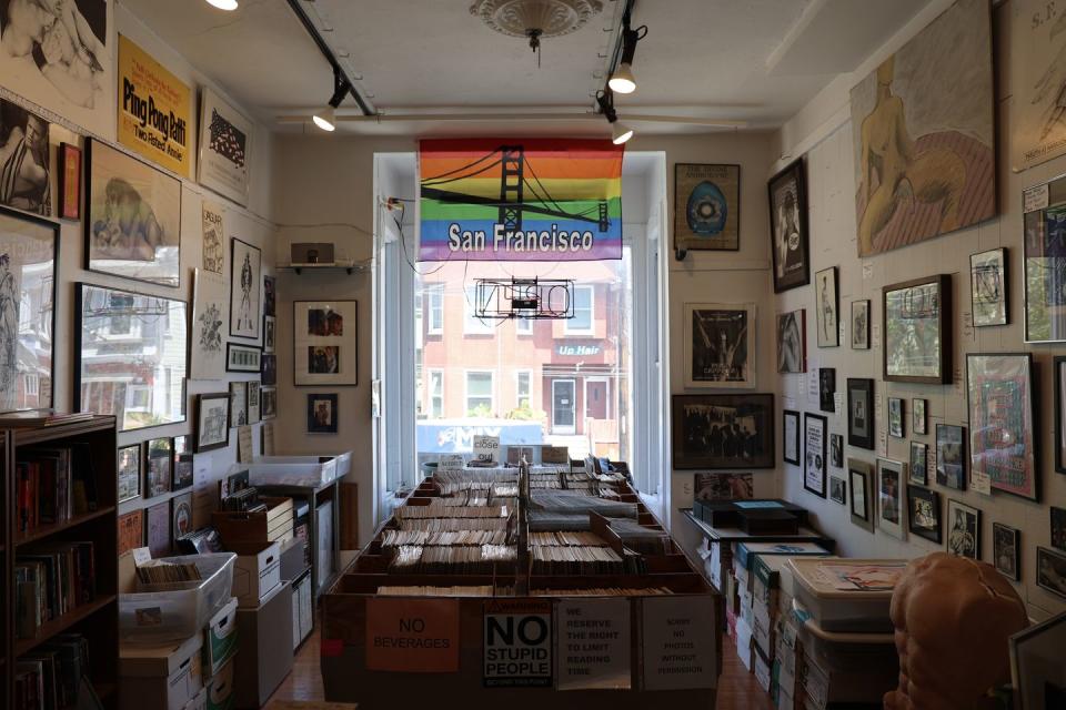 a room with many framed pictures