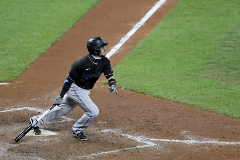 Miami Marlins' Eddy Alvarez watches a foul ball to right field during the fifth inning in the second game of a baseball doubleheader against the Baltimore Orioles, Wednesday, Aug. 5, 2020, in Baltimore. Among the Marlins' roster replacements following their coronavirus outbreak was infielder Alvarez, a 2014 Olympic silver medalist in speedskating. (AP Photo/Julio Cortez)