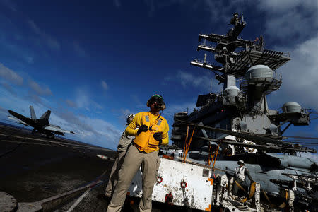 An F/A-18 Super Hornet lands on the deck of the USS Ronald Reagan at the South China Sea September 30, 2017. REUTERS/Bobby Yip