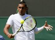 Nick Kyrgios of Australia hits a shot during his match against Milos Raonic of Canada at the Wimbledon Tennis Championships in London, July 3, 2015. REUTERS/Stefan Wermuth