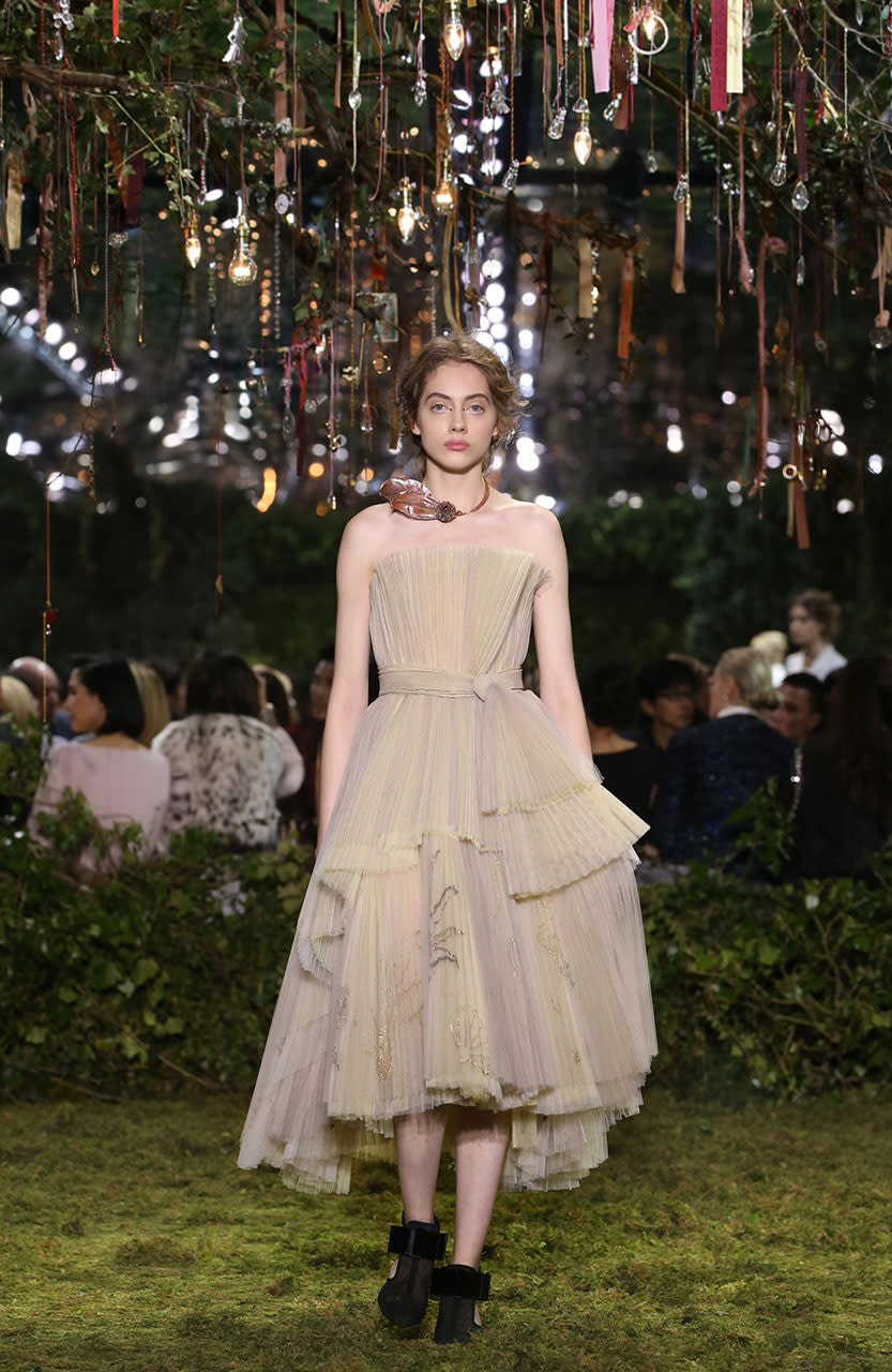 <p>This dress in a symphony of pleated and dégradé taupe-to-straw-colored tulle embroidered with a subtle summer symbols. (Photo: Getty Images) </p>