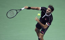 Roger Federer serves to Sumit Nagal during the first round of the U.S. Open tennis tournament in New York, Monday, Aug. 26, 2019. (AP Photo/Charles Krupa)