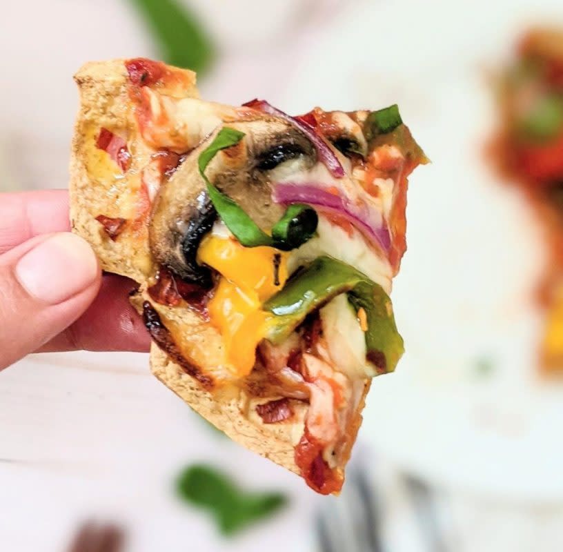 <p>The Herbeevore</p><p>A crispy, high-protein dream snack starts with cooking tofu in the waffle maker- genius!</p><p><strong>Get the recipe: <a href="https://parade.com/1255444/kavitharamaswamy/tiktok-tofu-pizza-waffles/" rel="nofollow noopener" target="_blank" data-ylk="slk:TikTok Tofu Pizza Waffles;elm:context_link;itc:0;sec:content-canvas" class="link ">TikTok Tofu Pizza Waffles</a></strong></p>