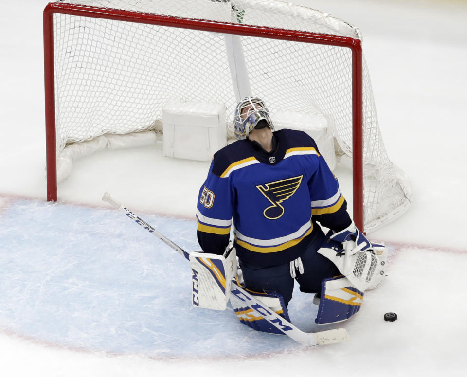 St. Louis Blues goaltender Jordan Binnington reacts after giving up a goal to Winnipeg Jets' Patrik Laine, of Finland, during the second period in Game 3 of an NHL first-round hockey playoff series Sunday, April 14, 2019, in St. Louis. (AP Photo/Jeff Roberson)