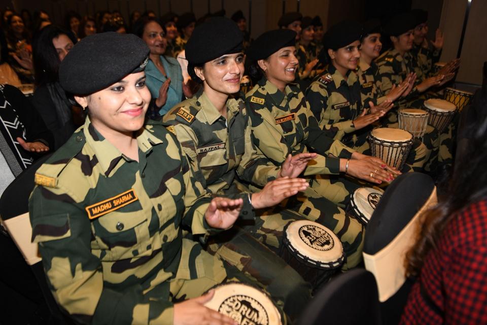 Indian Border Security Force (BSF) women personnel play the drums during a Drum Cafe a team building event at a hotel in Amritsar on February 8,2020. (Photo by NARINDER NANU / AFP) (Photo by NARINDER NANU/AFP via Getty Images)