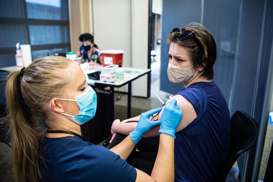 UNC Asheville student Luna Little receives the Johnson & Johnson vaccine on Thursday, April 8, 2021, at the Reuter Center on UNCA's campus. Boosters protecting against the omicron variant are now available.