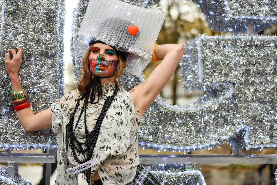 A model showcases Pierre Garroudi latest collection during the flash mob fashion show at Sloane Square. (Photo by Pietro Recchia / SOPA Images/Sipa USA)