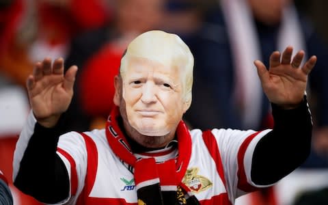 General view of a Doncaster Rovers fan in a Donald Trump mask - Credit: REUTERS