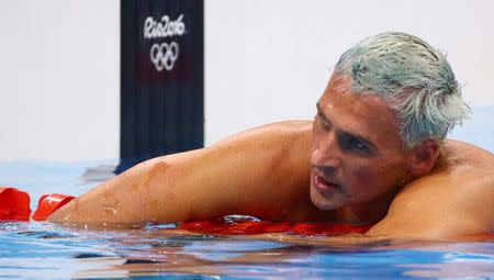 2016 Rio Olympics - Swimming - Final - Men's 200m Individual Medley Final - Olympic Aquatics Stadium - Rio de Janeiro, Brazil - 11/08/2016. Ryan Lochte (USA) of USA reacts. REUTERS/David Gray/File Photo