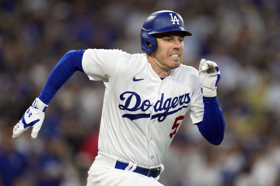 Los Angeles Dodgers' Freddie Freeman runs for a infield single during the first inning in Game 2 of a baseball NL Division Series against the Arizona Diamondbacks, Monday, Oct. 9, 2023, in Los Angeles. (AP Photo/Ashley Landis)