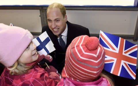 Prince William in Finland, where he was given an apron to pass to Prince Harry and Meghan Markle - Credit:  Heikki Saukkomaa