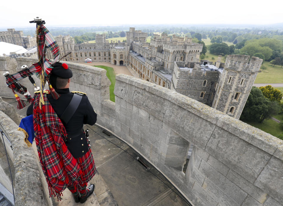 Her Majesty The Queen's Piper, Pipe Major Richard Grisdale, of The Royal Regiment of Scotland, on top of the Round Tower at Windsor Castle, joining pipers and musicians in marking the Battle of St Valery-en-Caux, where he played the pipers' march Heroes of St Valery to commemorate the thousands of Scots who were killed or captured during "the forgotten Dunkirk" 80 years ago.
