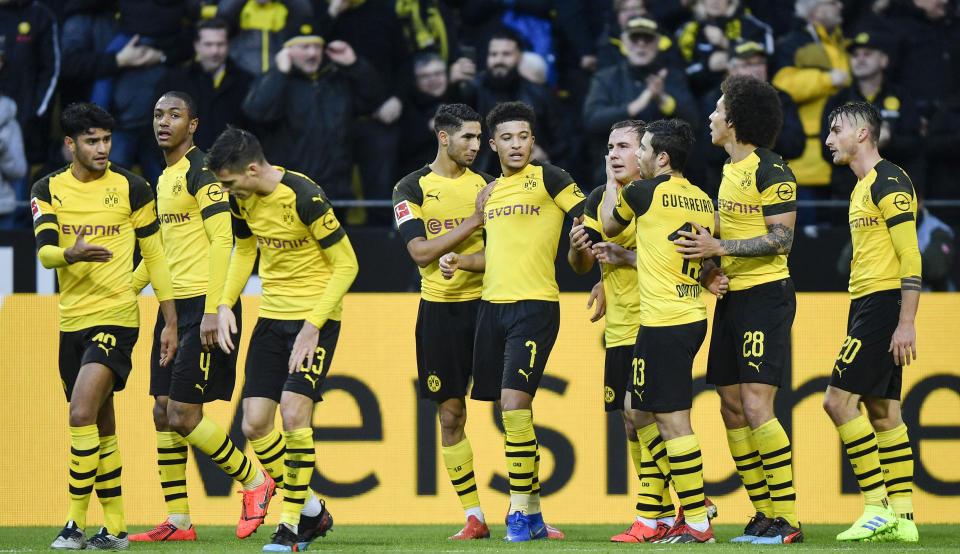 Dortmund celebrates their second goal by Mario Goetze, center, during the German Bundesliga soccer match between Borussia Dortmund and TSG 1899 Hoffenheim in Dortmund, Germany, Saturday, Feb. 9, 2019. (AP Photo/Martin Meissner)