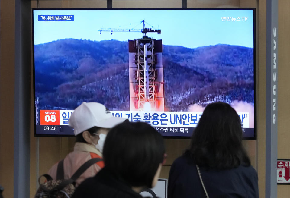 A TV screen shows a file image of North Korea's rocket launch during a news program at the Seoul Railway Station in Seoul, South Korea, Monday, May 29, 2023. Japan's coast guard said North Korea has notified it that it plans to launch a satellite in coming days. (AP Photo/Ahn Young-joon)