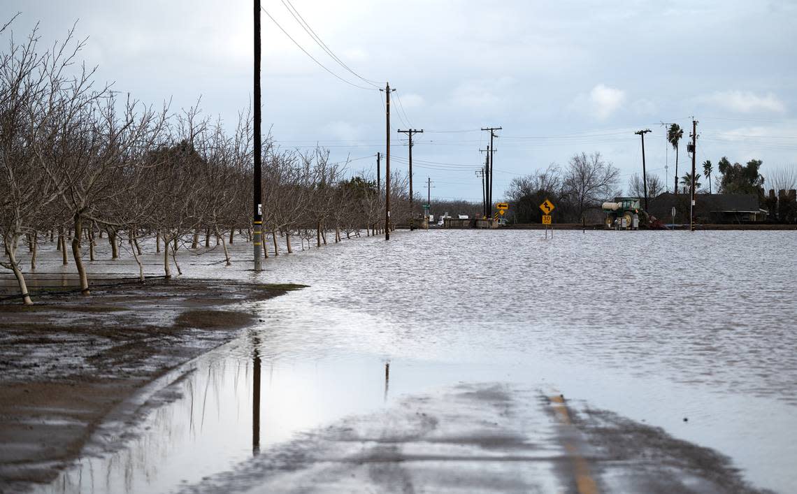 Anderson Road is under water from the Orestimba Creek in Newman, Calif., Tuesday, Jan. 10, 2023.