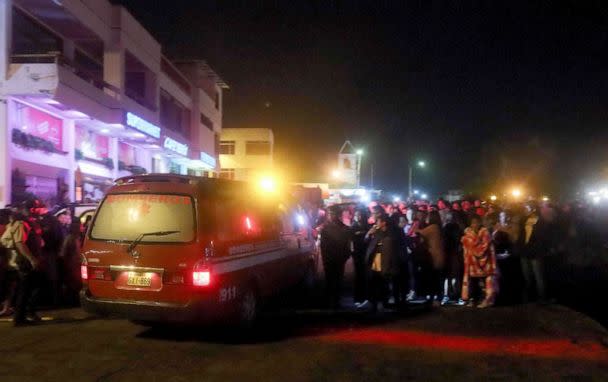 PHOTO: People gather at the port of Puerto Ayora in Santa Cruz Island, in the Galapagos Islands, after a boat with tourists sank in the archipelago located 1,000 km off the coast of Ecuador in the Pacific Ocean, on September 25, 2022. (Carlos Villalba/AFP via Getty Images)