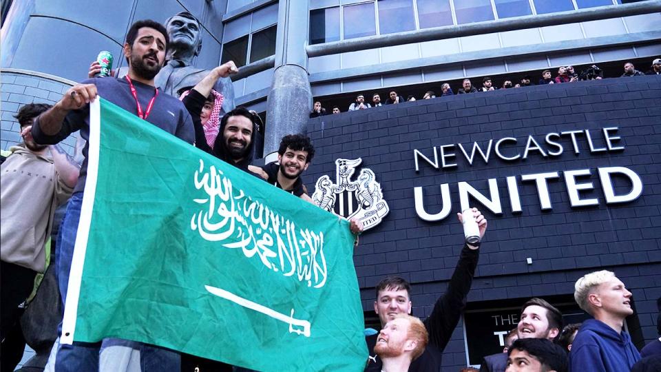 Fans celebrate outside of St James' Park after Newcastle United were taken over by Saudi Arabia's Public Investment Fund (PIF).