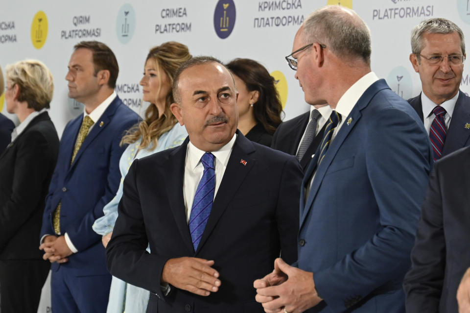 Turkish Foreign minister Mevlut Cavusoglu, center, attends the Crimean Platform Summit in Kyiv, Ukraine, Monday, Aug. 23, 2021. The Crimea Platform is a new international consultation and coordination format to strengthen an international response to the ongoing Russia's occupation of Crimea. (Ukrainian Presidential Press Office via AP)