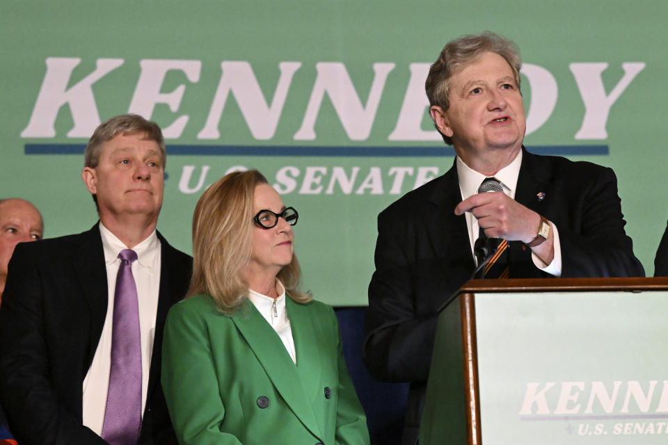 Sen. John Kennedy, joined by his wife, Becky, left, addresses supporters during his election night party, Tuesday, Nov. 8, 2022, at the Lod Cook Alumni Center on the campus of LSU in Baton Rouge, La. (Hilary Scheinuk/The Advocate via AP)