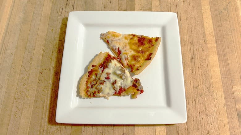 Slices of Lou Malnati's frozen thin crust pizza