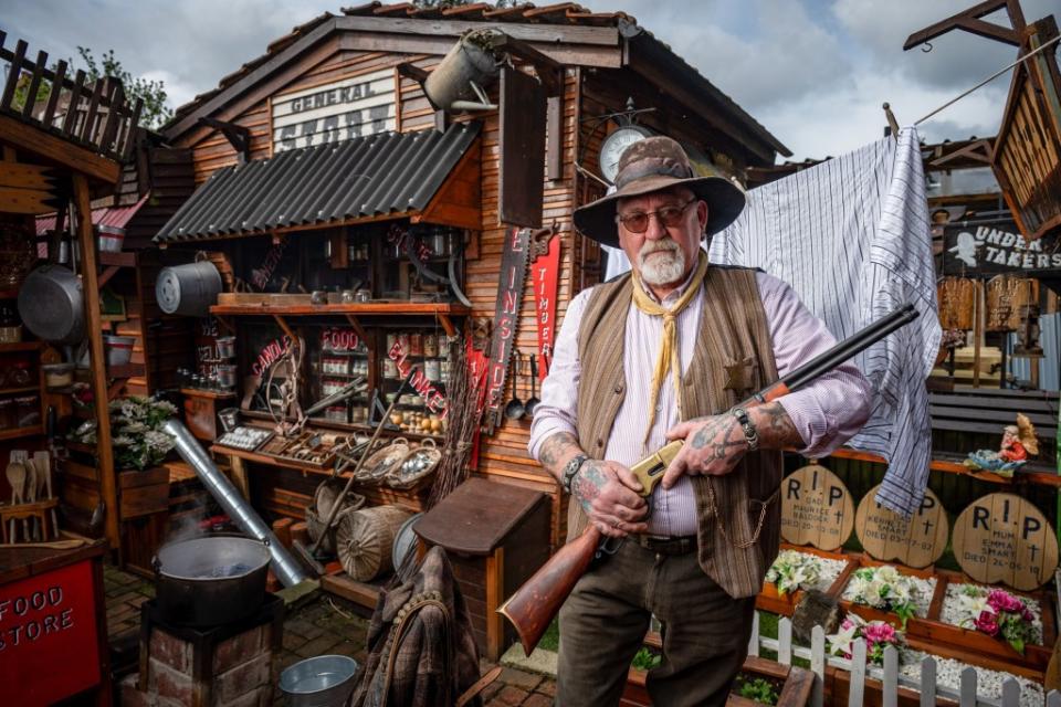 Western superfan Steve Smart from the Isle of Sheppey has over the years turned his front and back garden into a Wild West town complete with Bank, Saloon, General stores and more. James Linsell Clark / SWNS