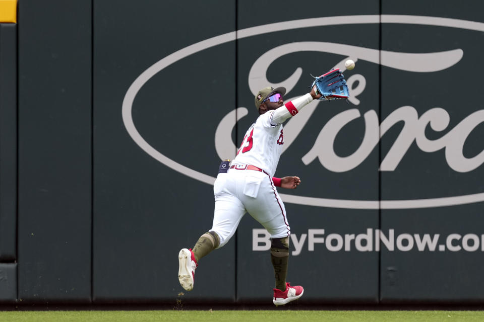 Atlanta Braves center fielder Michael Harris II makes a running catch on a fly ball off the bat of Seattle Mariners' Ty France in the first inning of a baseball game, Sunday, May 21, 2023, in Atlanta. (AP Photo/John Bazemore)