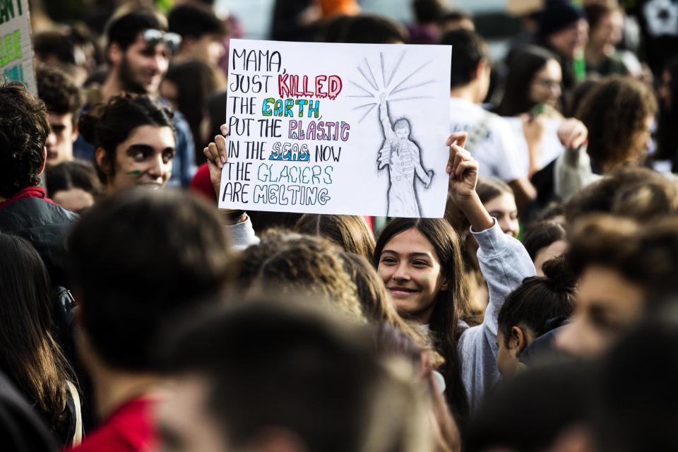 Young people attend a protest of the Fridays For Future movement in Rome, Italy, Friday, Nov. 29, 2019. Environmentalists around the world are joining a global day of protests Friday, in a symbolic gesture to demand that governments act against climate change. (Angelo Carconi/ANSA via AP)