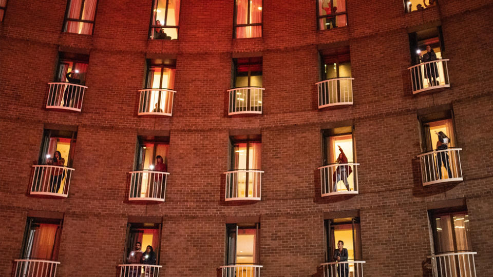 Hotel guests watching a musical performance from their rooms during their final night of quarantine at the Sofitel Wentworth in Sydney, Monday, May 18, 2020.