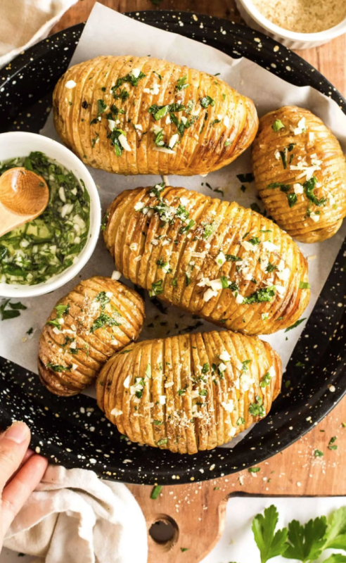 <p>Dish by Dish</p><p>These crispy Hasselback potatoes are super easy to make, have insanely crispy skins with tender soft interiors, and are flavored with fragrant garlic and fresh parsley!</p><p><strong>Get the recipe: <a href="https://www.dishbydish.net/crispy-hasselback-potatoes/" rel="nofollow noopener" target="_blank" data-ylk="slk:Crispy Hasselback Potatoes;elm:context_link;itc:0;sec:content-canvas" class="link ">Crispy Hasselback Potatoes</a></strong></p>