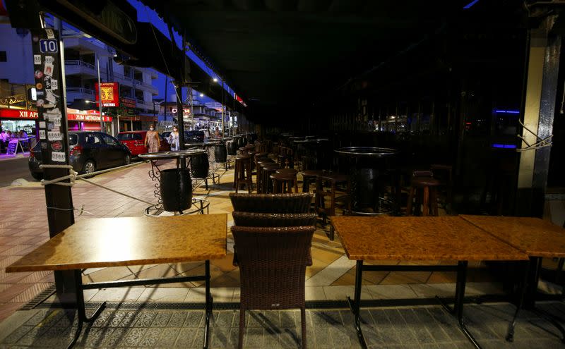 FILE PHOTO: People walk in the Bierstrasse street (Miquel Pellisa street) in El Arenal beach in Mallorca