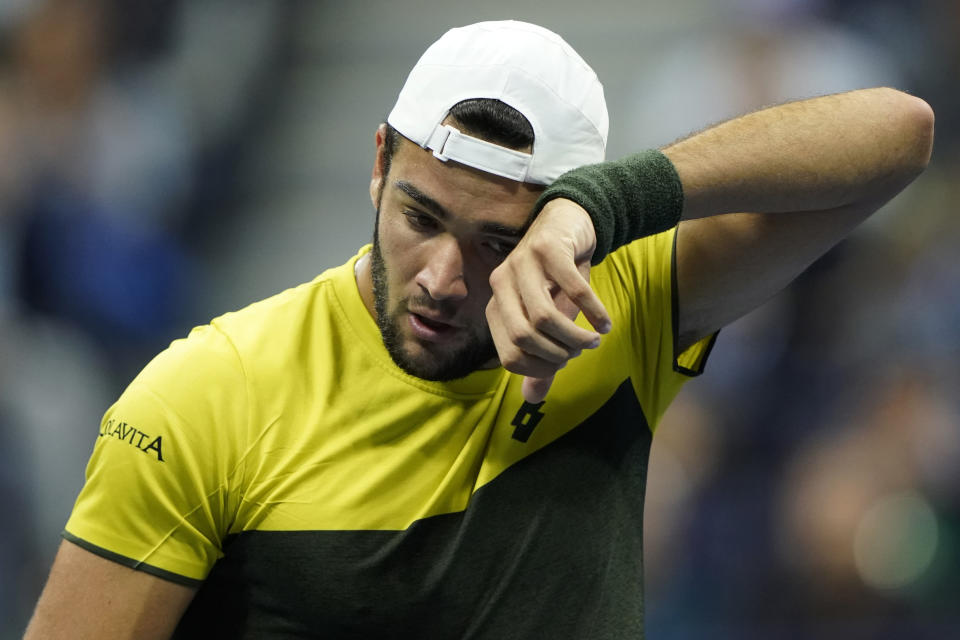 Matteo Berrettini, of Italy, wipes sweat from his face during the men's singles semifinals of the U.S. Open tennis championships against Rafael Nadal, of Spain, Friday, Sept. 6, 2019, in New York. (AP Photo/Eduardo Munoz Alvarez)