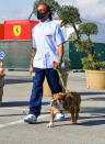 <p>Lewis Hamilton arrives with a pup at the Formula One Turkish Grand Prix at Istanbul Park on Wednesday in Istanbul, Turkey.</p>