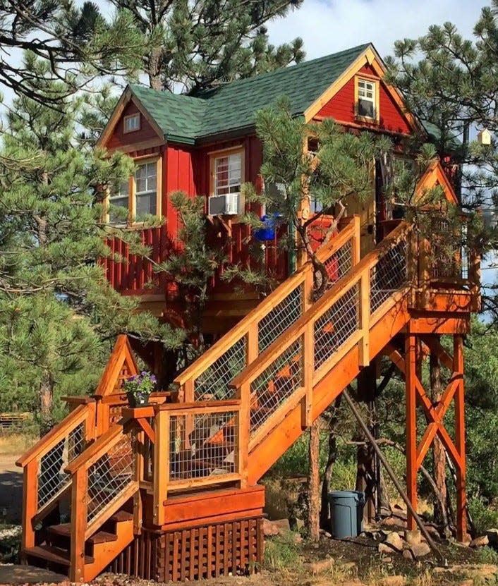 The Little Red Treehouse in Lyons has enough space for two as well as an outdoor swing and pergola.