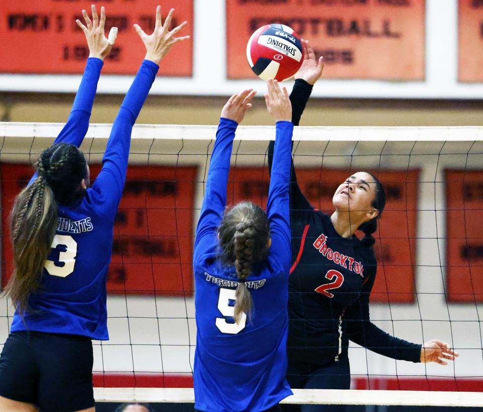 Brockton's Kiara Shields spikes the volleyball during a game versus Quincy on Wednesday, Sept. 7, 2022. 