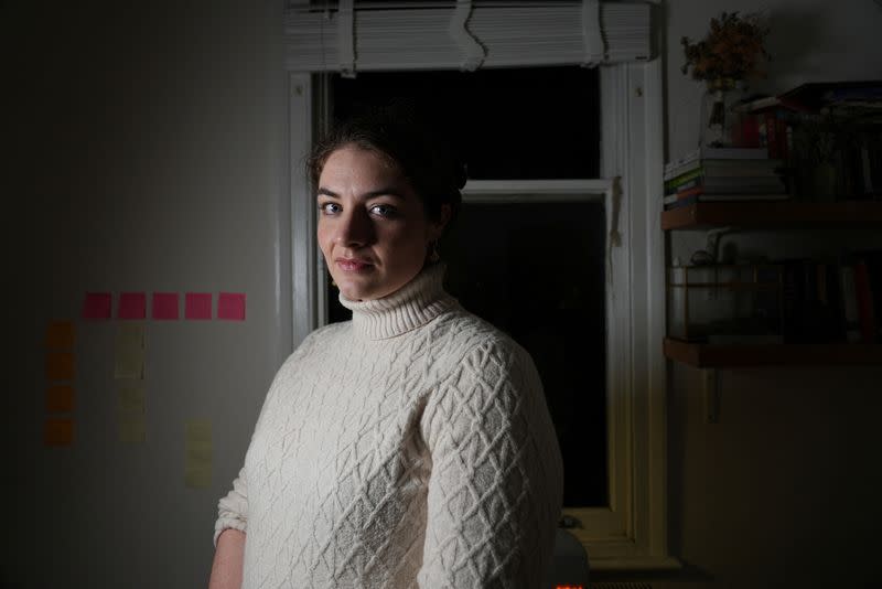 Alexandra Kimmons poses at her home during an interview with Reuters, in London