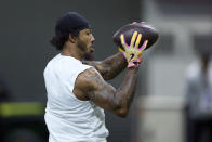 Washington wide receiver Ja'lynn Polk catches a pass during Washington's NFL Pro Day, Thursday, March 28, 2024, in Seattle. (AP Photo/John Froschauer)