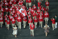 LONDON, ENGLAND - JULY 27: Simon Whitfield of the Canada Olympic triathlon team carries his country's flag during the Opening Ceremony of the London 2012 Olympic Games at the Olympic Stadium on July 27, 2012 in London, England. (Photo by Quinn Rooney/Getty Images)