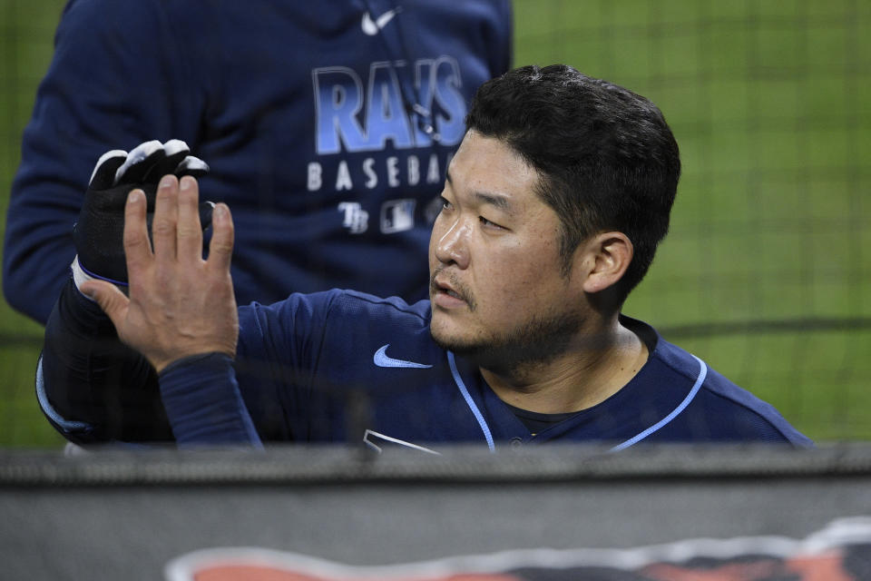 Tampa Bay Rays' Yoshitomo Tsutsugo, of Japan, celebrates his home run, at the dugout during the third inning of the team's baseball game against the Baltimore Orioles, Saturday, Sept. 19, 2020, in Baltimore. (AP Photo/Nick Wass)